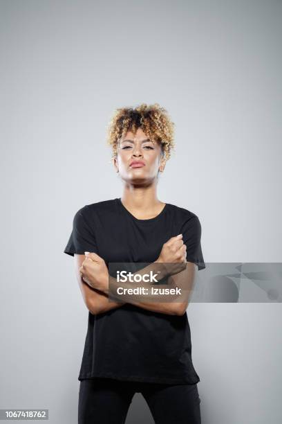 Portrait Of Brave Young Woman Stock Photo - Download Image Now - One Woman Only, Women, Fist