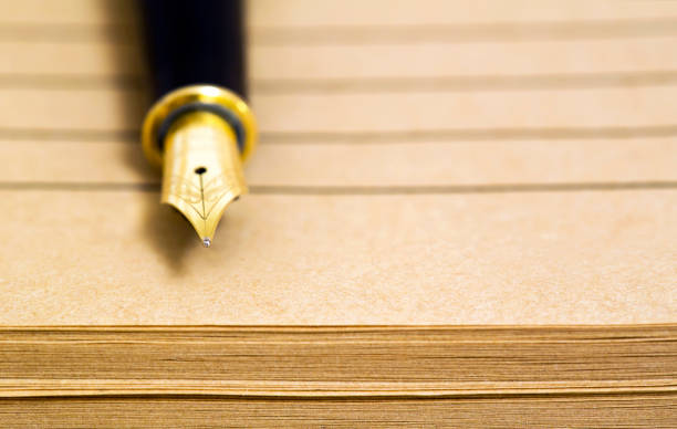 istock Old fountain pen on paper 1067423432
