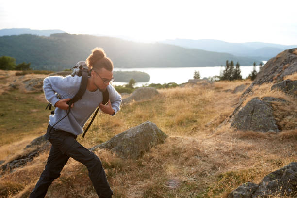 istock A young mixed race man running alone in the mountains 1067423854