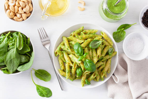 istock penne pasta with spinach basil pesto sauce 1067425188