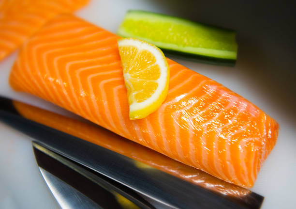 Salmon slices with some spices close up still