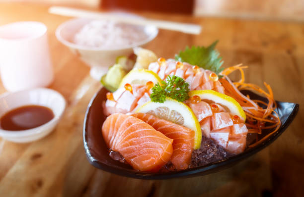 istock Salmon sashimi cutting and serve. 1067429946