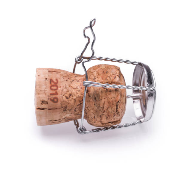 istock A champagne or sparkling wine cork from 2019 lying on the ground. Isolated on white background. 1067429960