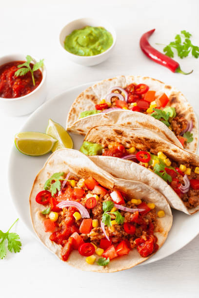 istock mexican beef and pork tacos with salsa, guacamole and vegetables 1067430058