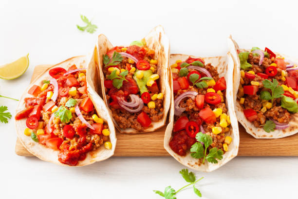 istock mexican beef and pork tacos with salsa, guacamole and vegetables 1067431234