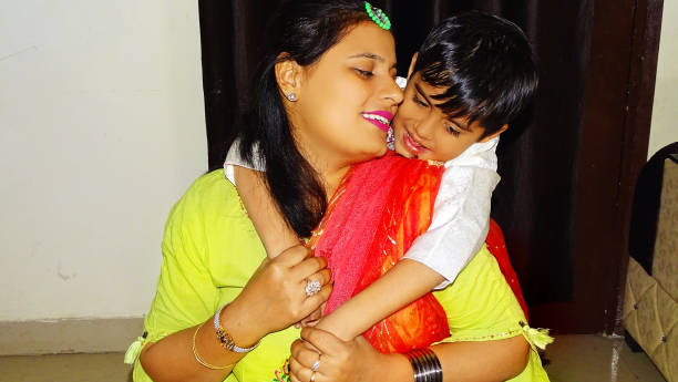 istock Mother & child hugging portrait at home 1067433226