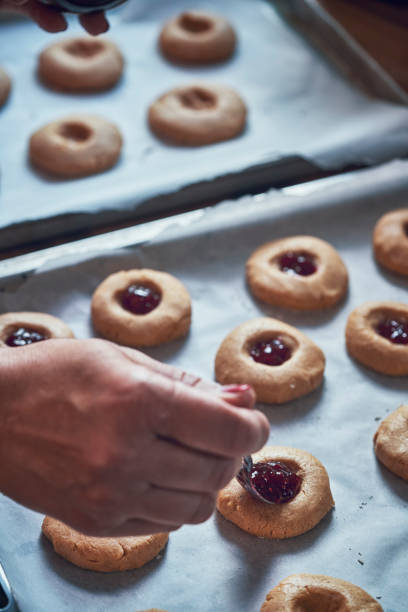 istock Preparing Peanut Butter Cookies with Marmalade in Domestic Kitchen 1067433482