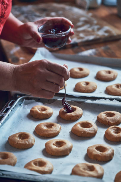 istock Preparing Peanut Butter Cookies with Marmalade in Domestic Kitchen 1067433504