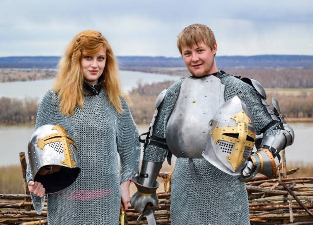 istock Knight with his wife in armor and chain mail. 1067437592