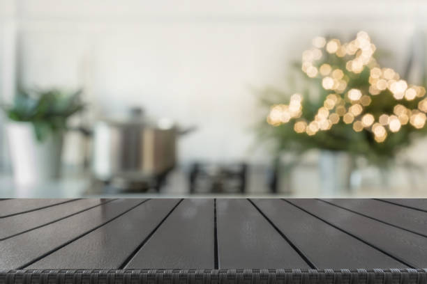 istock Christmas table background with christmas tree in kitchen out of focus. Background for display your products. 1067438398