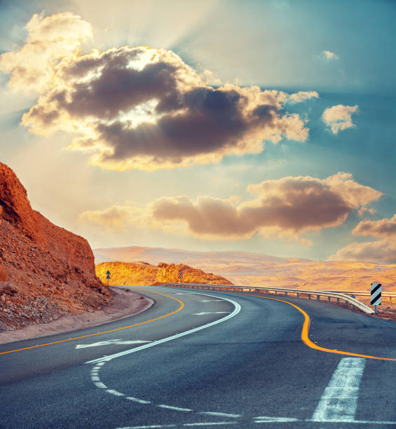 istock The mountain winding road at sunset 1067440716