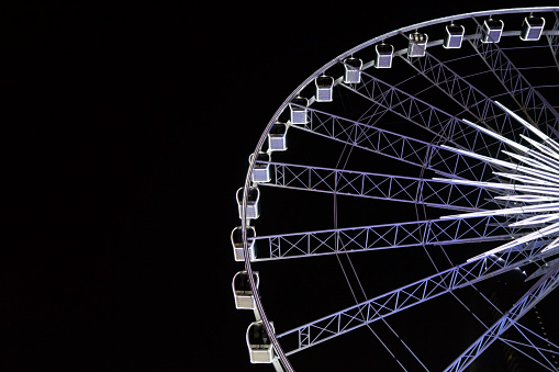 ferris wheel rolling high in the sky at night