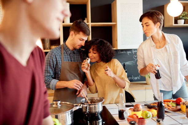 istock Group of Friends Cooking Together 1067443836