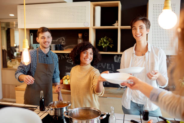 istock Group of Friends Cooking Together 1067444154