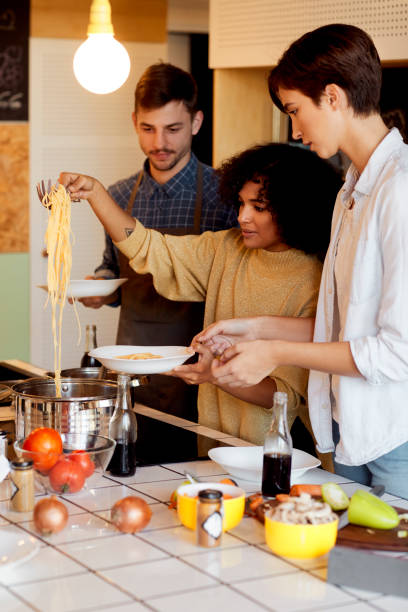 istock Group of Friends Cooking Together 1067445866
