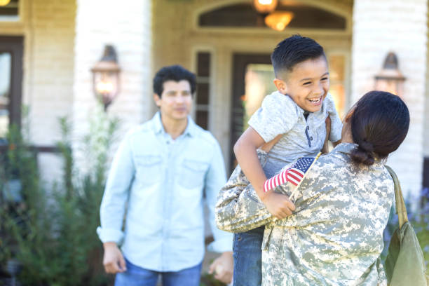 istock Excited boy greets army mom 1067448828