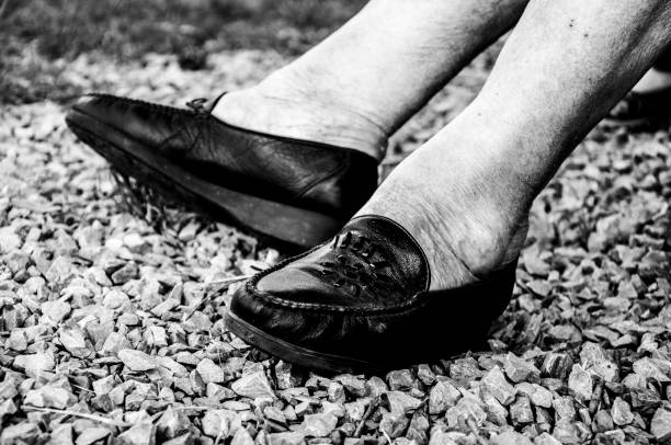 istock grandma's legs old sneakers outside 1067449596