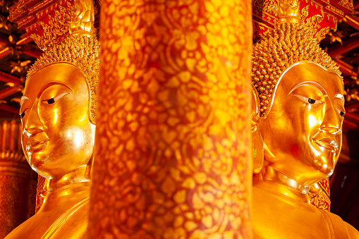 Ancient golden buddha statue at Wat Phumin, a famous buddhist temple in Nan Province, Thailand. Close. The temple is open to the Public.