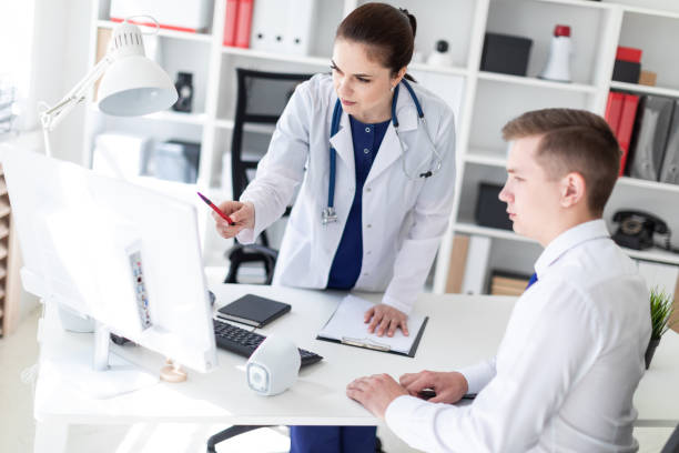 istock The doctor explains the problem to the patient on the computer. 1067450140
