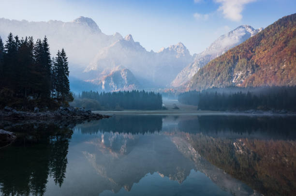 istock Panoramic view at sunrise over alpine lake in Italy 1067455368