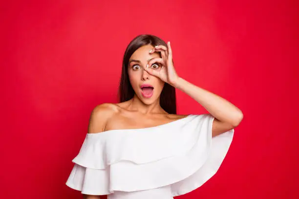 Portrait of nice adorable pretty dreamy foolish lady wearing white off-the-shoulders top showing ok-sign gesture like glasses opened mouth isolated over pastel red background