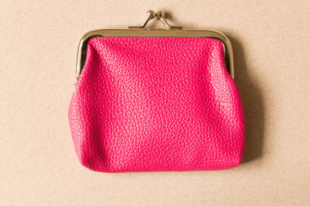 istock Pink wallet on light background . Close up. Top view 1067463754