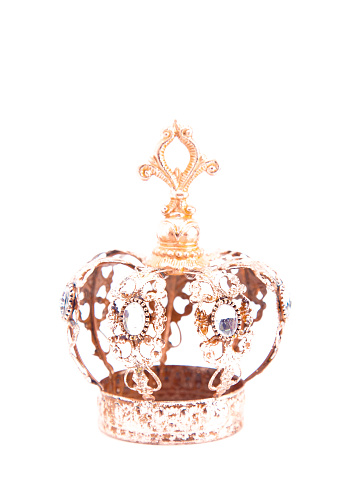 A Small Rose Gold Royal Crown on a White Background