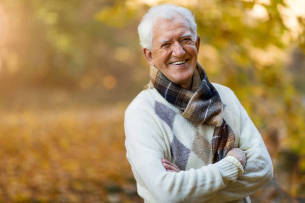 istock Happy senior man in autumn park 1067467226