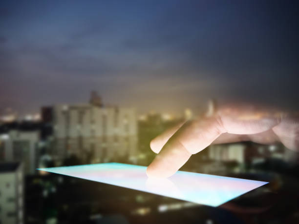istock Hand touching on screen of smartphone on blurred building background. 1067470420