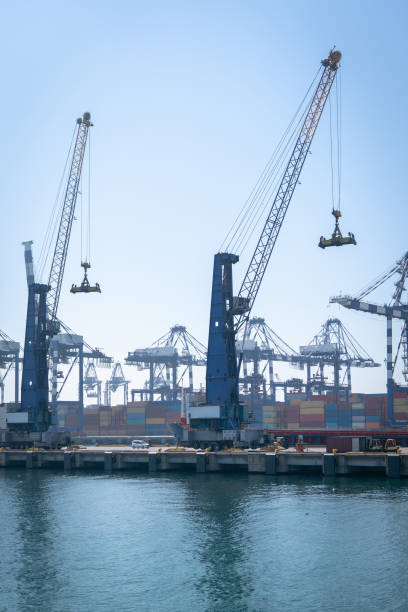 istock Logistics and transportation container cargo ship, logistics crane bridge Shipyard working with import export and industry background transport 1067474716