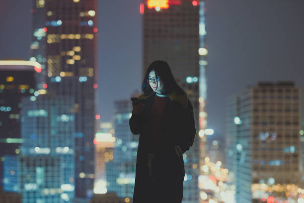 istock Asian Woman Using a Mobile Phone 1067475156