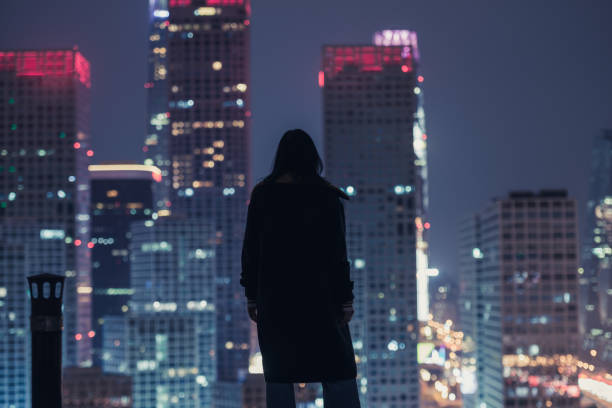 istock Female Standing in Front of Modern City 1067475516