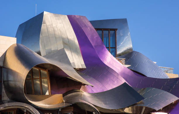 marquis de riscal winery hotel Elciego, Alava , Spain. 25 september, 2018: Detail of the wine colored metallic corrugated structures of a building designed by the architect Frank O. Gehry, for the Hotel Marques de Riscal wineries, frank gehry building stock pictures, royalty-free photos & images