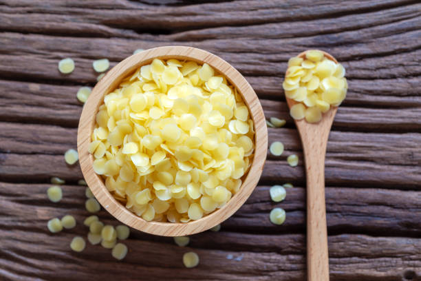 yellow natural beeswax pure organic yellow beeswax pellets for homemade natural  beauty and D.I.Y. preoject. beeswax photos stock pictures, royalty-free photos & images