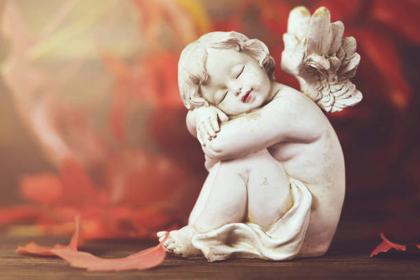 istock Angel and red autumn leaves 1067486664