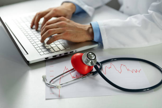istock cardiology - doctor cardiologist working on laptop computer in office 1067499316