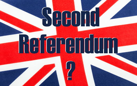 Second Referendum with a question mark written on a British Union jack flag. Photograph with added text.