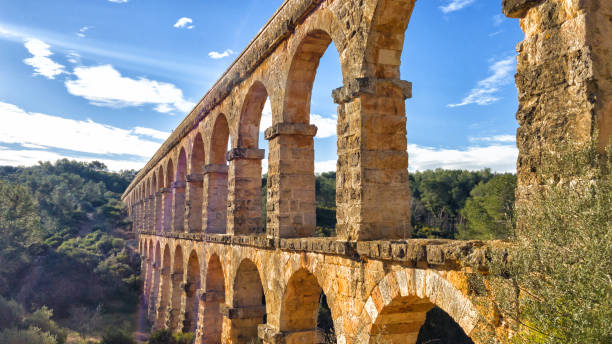 Arches of the old stone Roman aqueduct in Tarragona, Catalonia, Spain stock photo