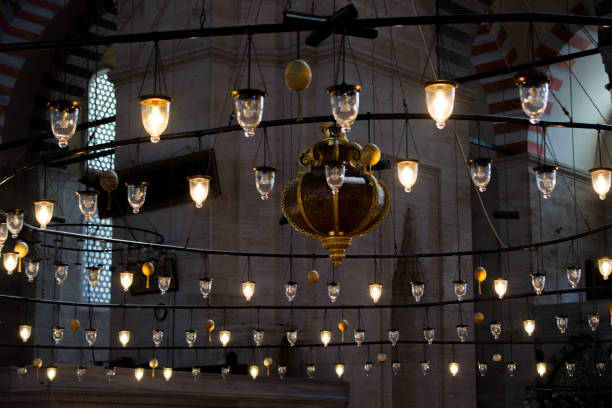 istock Bright mosque lamps on a circular chandelier 1067505578