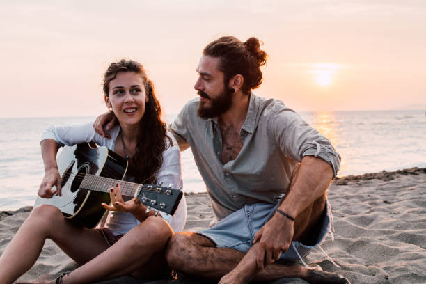 istock Happy people with acoustic guitar 1067507246