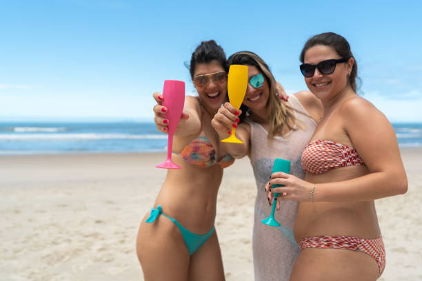 istock Best Girlfriends on Celebratory Toast at Beach 1067508050