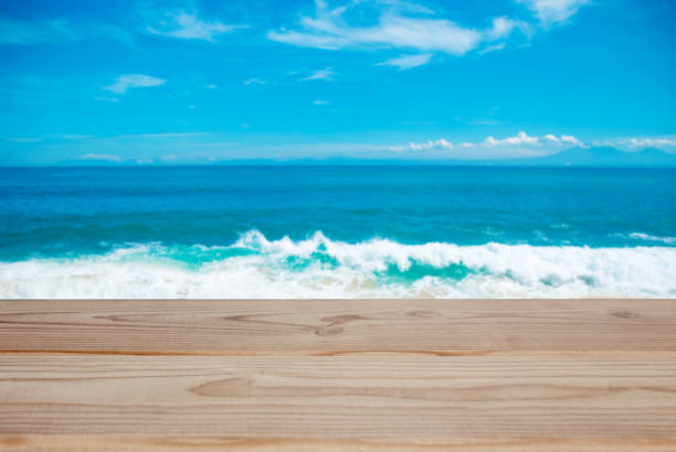 istock empty wooden tabletop on the ocean background 1067509898