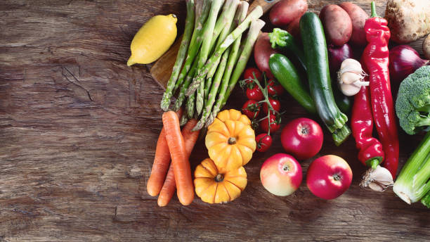 istock Various raw vegetables on wooden board. 1067510370