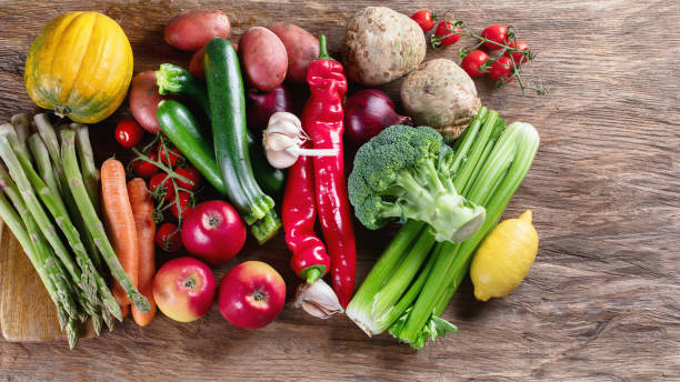 istock Various raw vegetables on wooden board. 1067510470