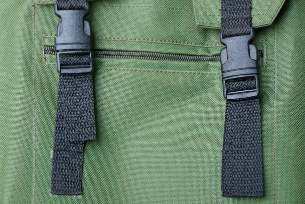 istock two black plastic carbine on a harness on a green fabric backpack 1067510590
