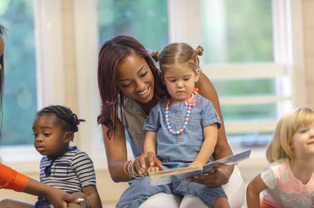 istock Preschool children reading with teacher 1067510838