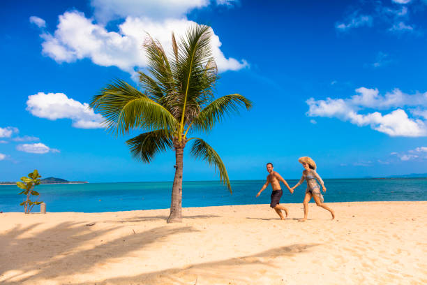istock Couple on tropical beach 1067513254