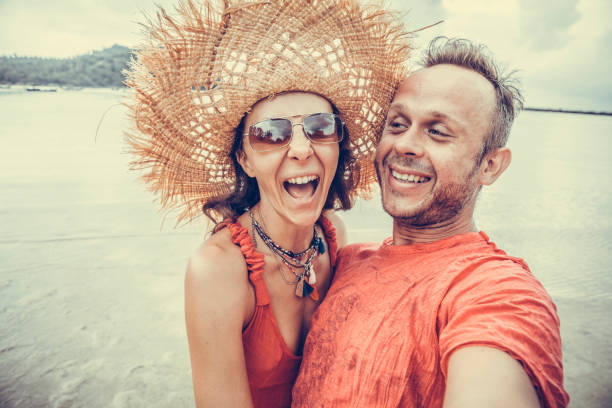 couple doing selfie photo on the tropical beach