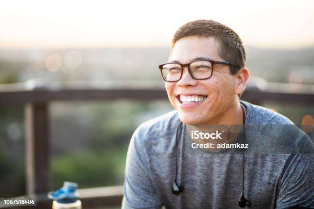 Portrait Of An Attractive Young Man Stock Photo - Download Image Now - Men, Smiling, Happiness