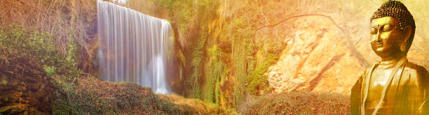 istock Figure of a buddha with a waterfall in the background 1067518498